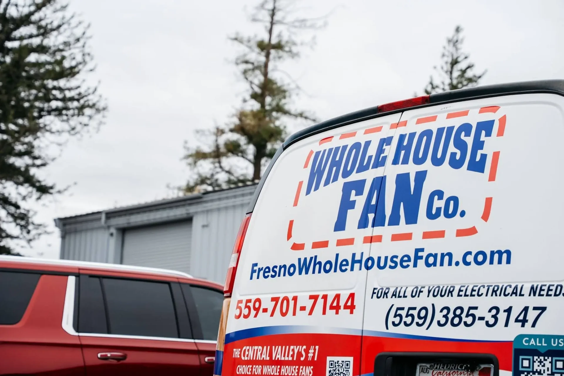 Whole House Fan Co. service van with company branding and contact information
